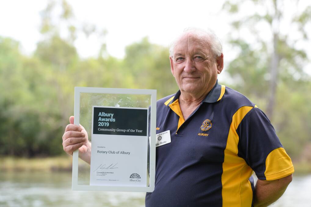 TEAM EFFORT: Mike Burke accepts the community group of the year award on behalf of Rotary Club of Albury. Picture: MARK JESSER