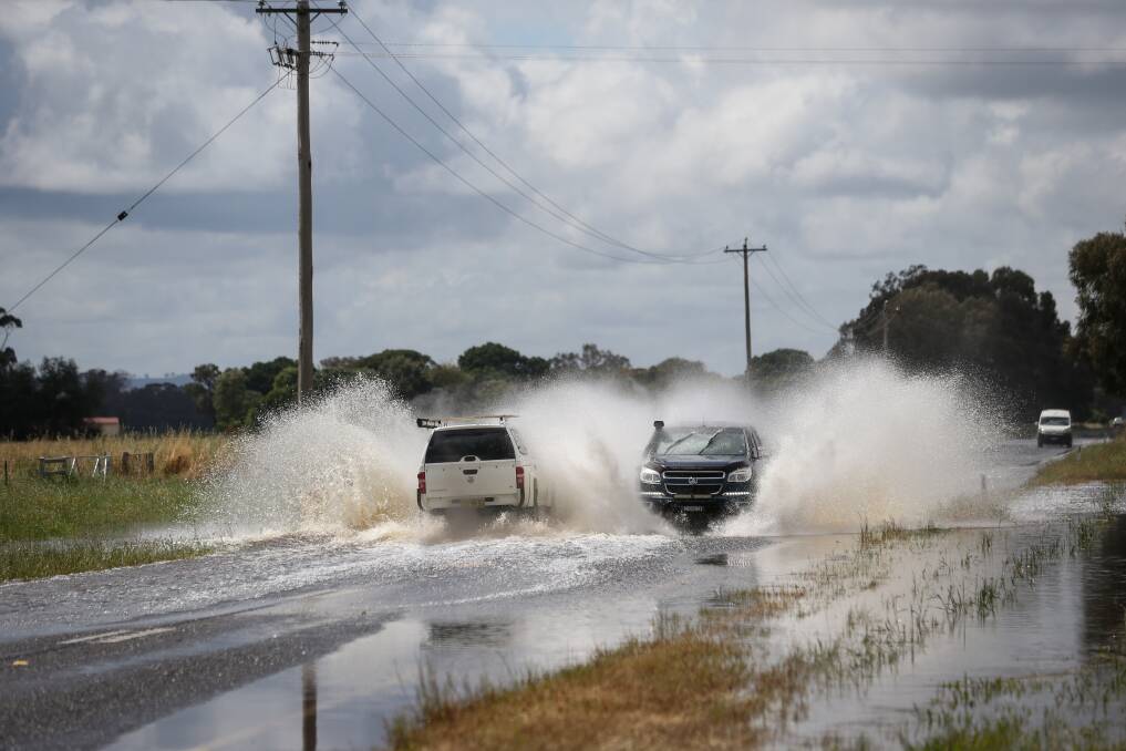 Water on the Riverina Highway east of Howlong on Monday proves challenging for drivers. Picture by James Wiltshire