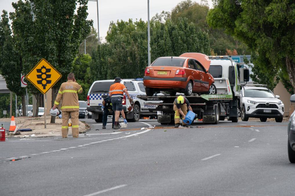 AFTERMATH: Emergency service personnel clear away the High Street crash in Wodonga on Saturday morning. Picture: TARA TREWHELLA 