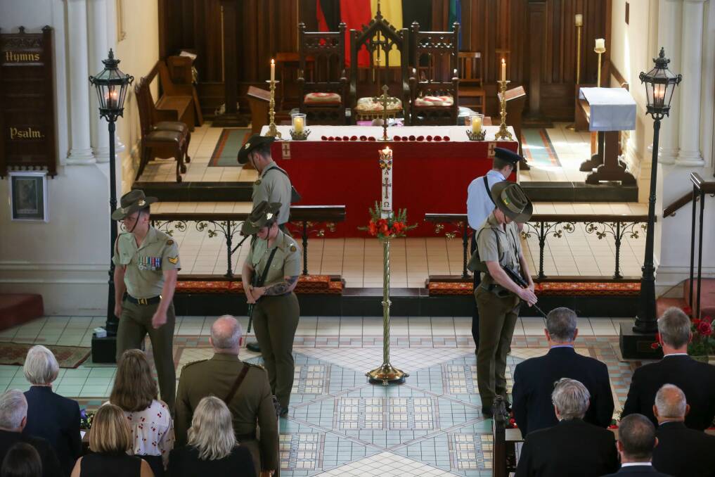 SOLEMN MEMORIAL: The mounting of the catafalque party takes place at St Matthew's Church Albury, where hundreds attended Monday's service. Picture: TARA TREWHELLA