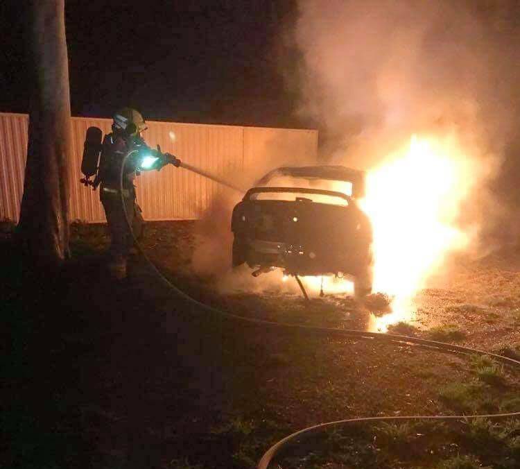 OVERNIGHT INCIDENT: Firefighters contain the flames but the car was completely destroyed. Picture: FIRE AND RESCUE NSW COROWA