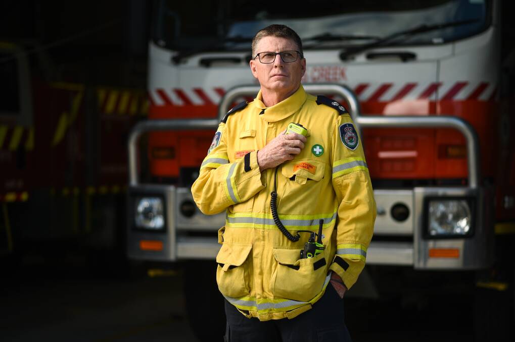 SHARING EXPERIENCES: NSW Rural Fire Service's Ian Avage, of Splitters Creek, says bushfire recovery will be "a long, long road" for many people. Picture: MARK JESSER