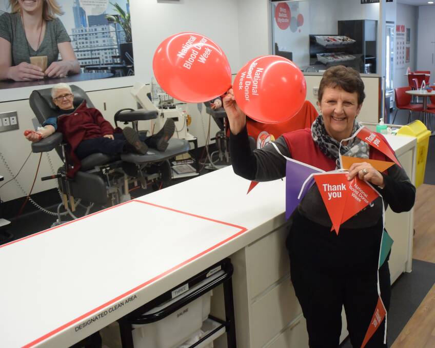 MANY THANKS: As blood and plasma is donated around her, Wodonga's Ronwyn Davies appreciates people's ongoing generosity at the Albury centre yesterday.