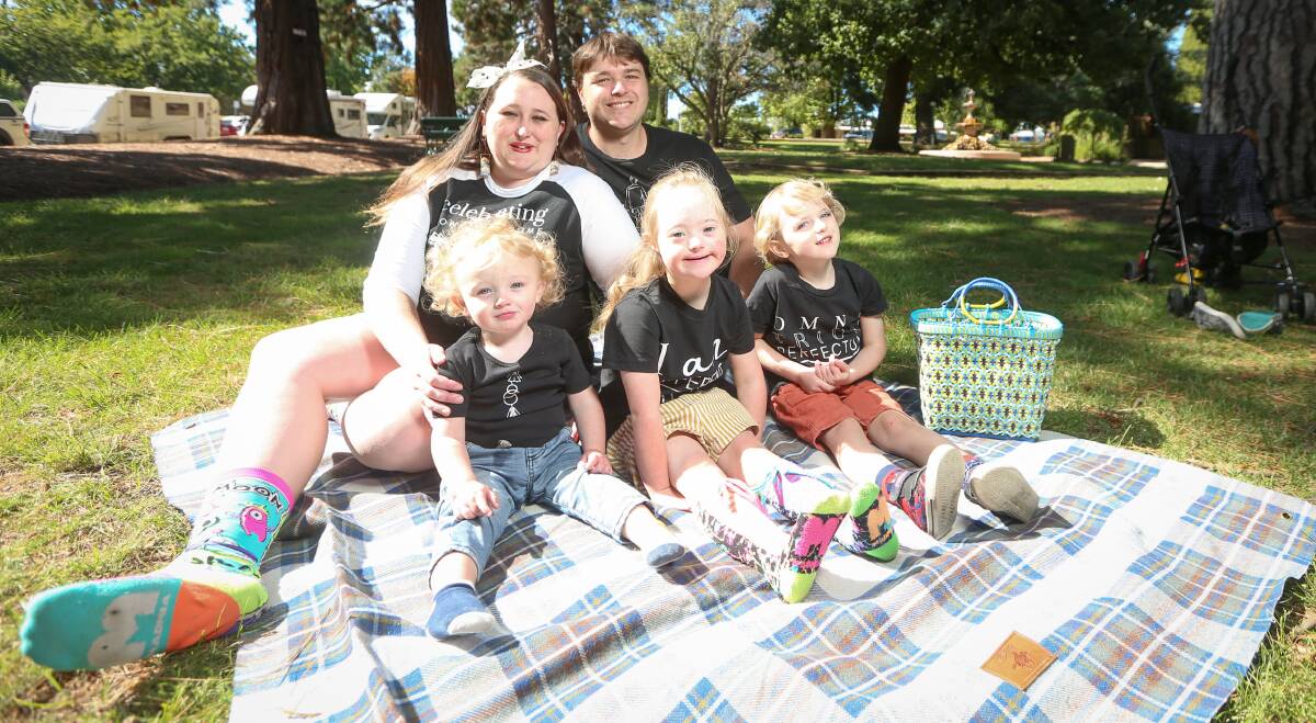 FAMILY FUN: Daily life is busy for Ellen and Lindsay Huggins and their three children Lachlan, 1, Cassie, 5, and Vincent, 3. Picture: JAMES WILTSHIRE
