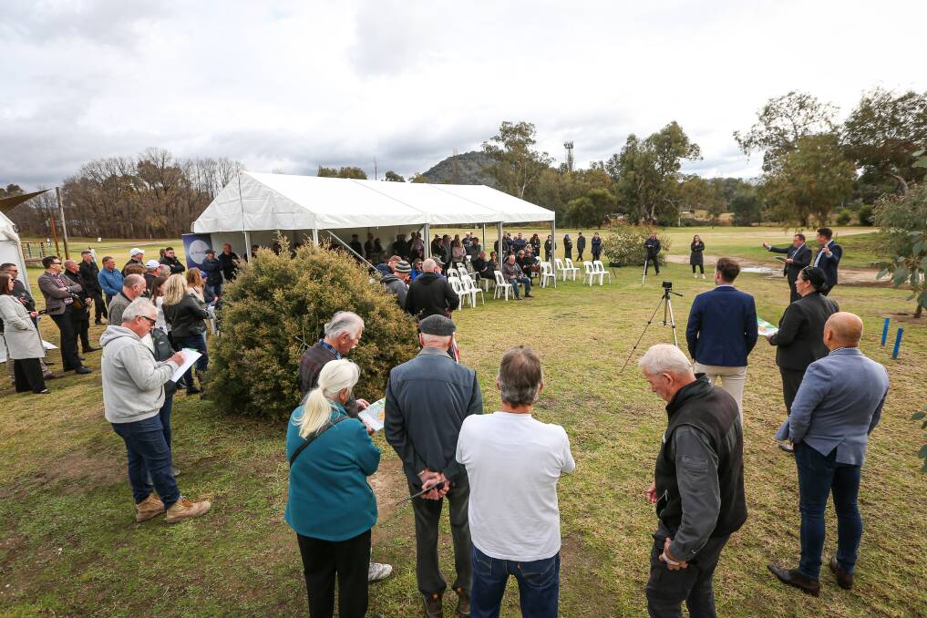 KEEN INTEREST: Bidders and spectators watch the progress of last month's auction of five housing blocks at Wodonga golf course. Despite cold weather and the coronavirus pandemic, the demand for property remains strong. Picture: JAMES WILTSHIRE