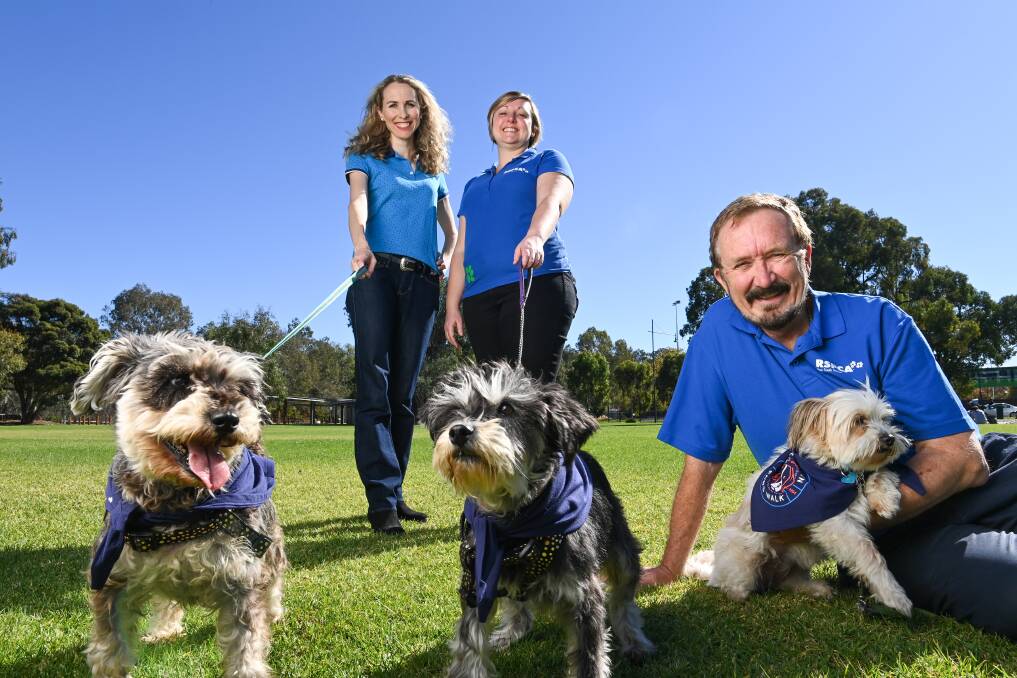 WILLING WALKERS: Albury RSPCA volunteers Sarah Little, with Molly, Lauren Black, with Rosie, and Arthur Frauenfelder, holding Moët hope Border dog lovers will join them at the 4 Paws Walk on May 23. Picture: MARK JESSER