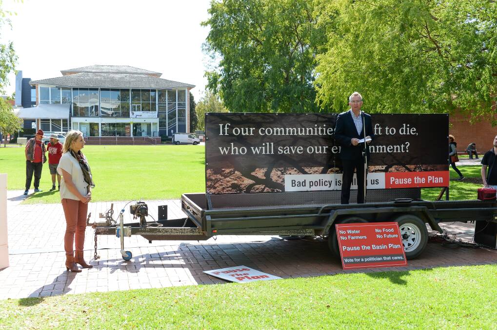 FLASHBACK: Independent candidate for Farrer Kevin Mack speaks to farmers protesting in Albury's QEII Square over water allocations while Farrer MP Sussan Ley watches on. The rally in April, during the federal election campaign, attracted about 1000 people.
