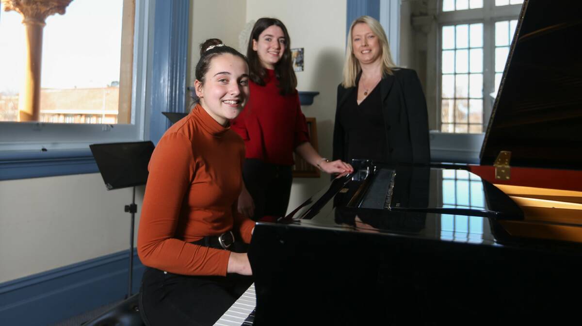 COMMUNITY SONGS: Murray Conservatorium youth council's Greta McAllister and Lucia McAllister and tutor Jenny O'Hara prepare to be vocal. Picture: TARA TREWHELLA