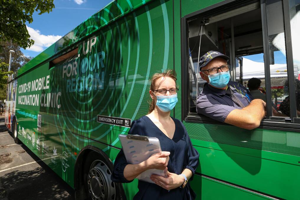 TOP GEAR: Albury Wodonga Local Public Health Unit COVID-19 vaccination program nurse manager Jenny Keogh and Dysons bus driver Steven Layton help out on Reggie's first day as a mobile vaccination clinic. Picture: JAMES WILTSHIRE