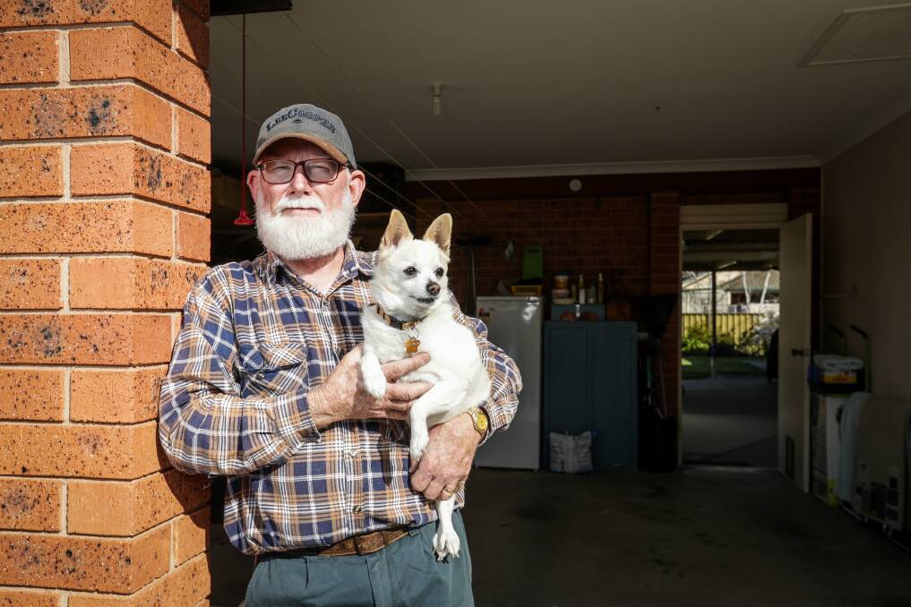 DISAPPOINTED: East Albury's John Hogan, with his dog Barney, says his weekend garage sale was a success overall, despite some theft early in the day. "Does it happen to other people?" he wondered. Picture: JAMES WILTSHIRE