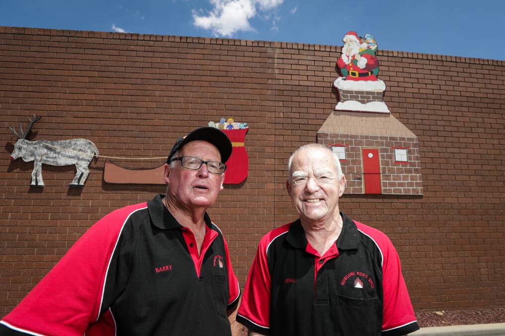 SANTA'S VISIT: Howlong Men's Shed members like Barry Cross and John Mailes have helped decorate their town. Picture: JAMES WILTSHIRE