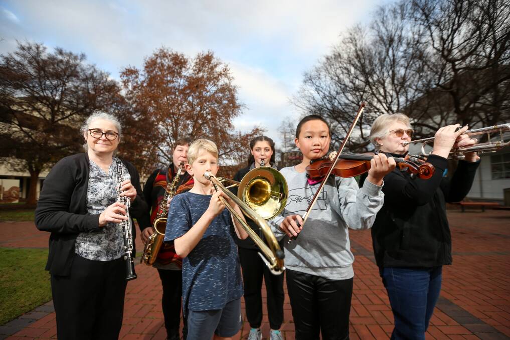 MUSIC MAKING: Border Music Camp is pivoting to a spring program, with Therese Scarfe, Mardi Sergi, Lucas Mordecai, 9, Samara Sergi, 17, Veda Zhang, 11, and Jennifer McMillan pleased to be back. Picture: JAMES WILTSHIRE