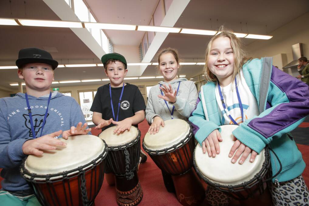 DRUMMING FUN: Young participants Tom Evans, 11, Riley Mullavey, 9, Milah Parker, 8, and April McGee, 9, yesterday. Picture: JAMES WILTSHIRE