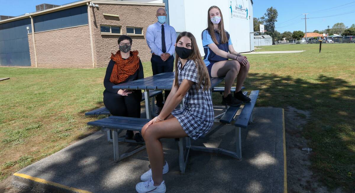 SCHOOL'S BACK: Wodonga Middle Years College campus principal Maree Cribbes, assistant principal Steve Fouracre and year 9 students Halle Moore and Annika Barton, both 15, are pleased to resume their regular routines. Picture: TARA TREWHELLA