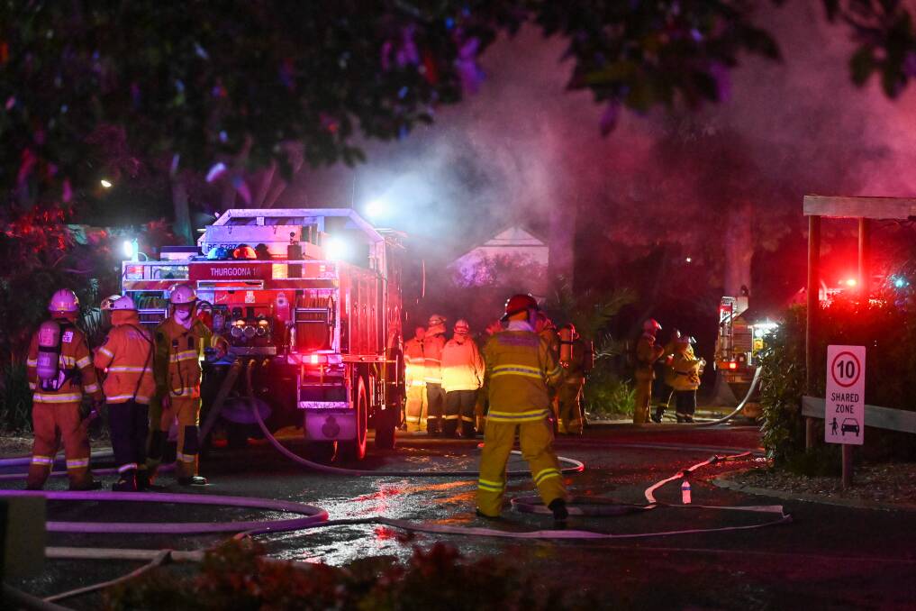 NIGHT ALERT: Firefighters work together to tackle a building fire at Lake Hume Resort this week. Authorities urge people to take care during winter, when house fires are more common. Picture: MARK JESSER
