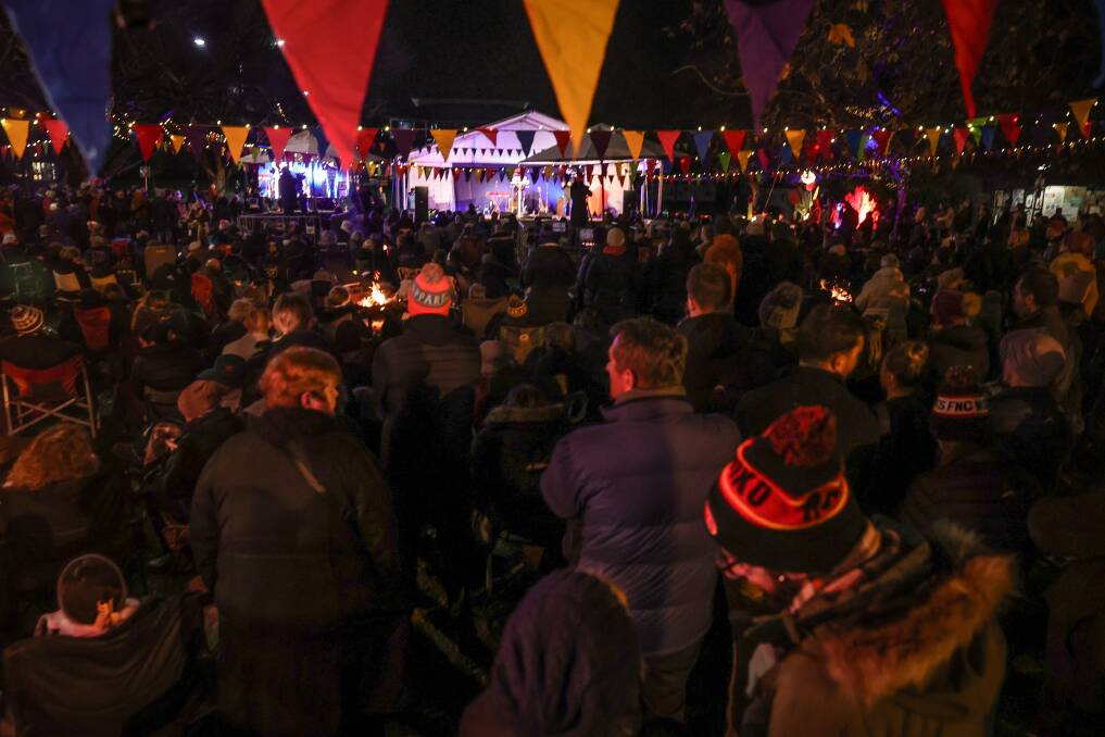 SOLEMN SCENE: Hundreds gather at Albury's QEII Square on the longest night of the year to take part in the Albury-Wodonga Winter Solstice. Picture: JAMES WILTSHIRE