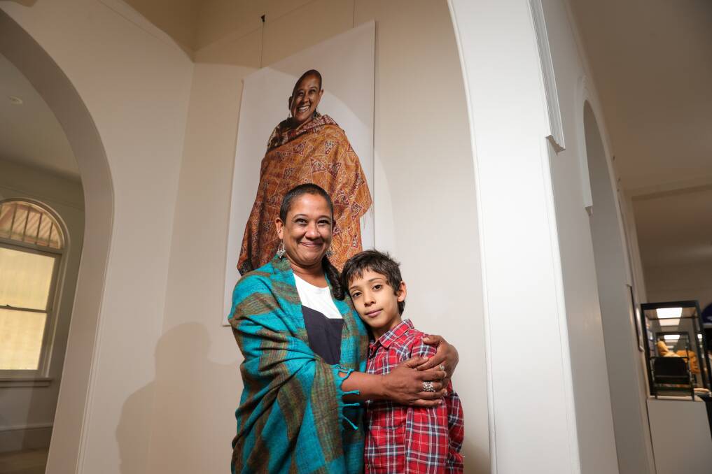 HUMBLED: Amandhi De Silva stands before her museum portrait with her son Kailash Kostir, 9. "It's nice to be doing what you love to do and contributing in a positive way without realising," she says. Picture: JAMES WILTSHIRE