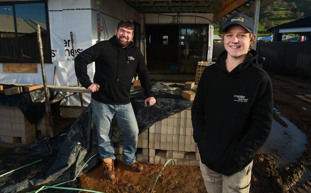EXPLORE ALL OPTIONS: Border builder Dale Paddle and his son Matthew, 16, a first year apprentice, hope next week's information night helps young people and their parents learn more about the industry. Picture: MARK JESSER