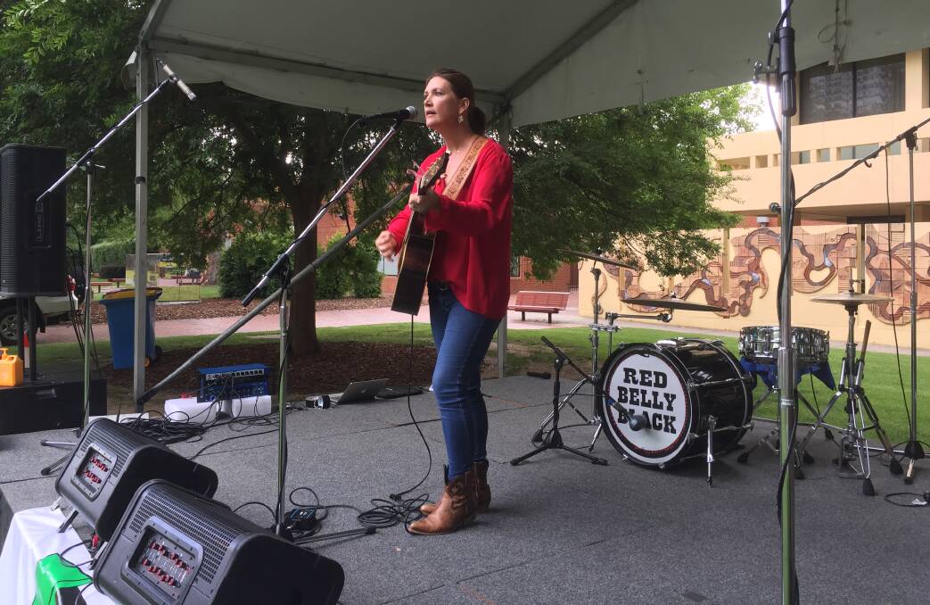 KEEN SUPPORTER: Country music star Sara Storer performs in Albury's QEII Square at the Step Out Against Violence community celebration.