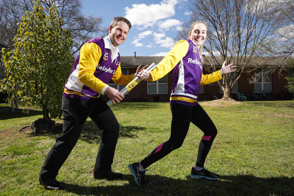 READY TO RUN: Border Relay For Life committee members Carl Friedlieb and Cristy Jacka say the new Border Baton is an Australian first. Picture: JAMES WILTSHIRE