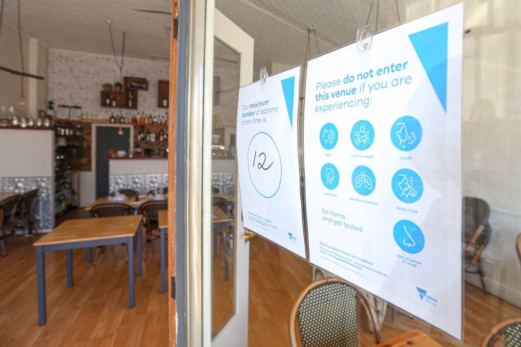 CHANGED CONDITIONS: The Ox and Hound Bistro, like all the Beechworth shops, has signage informing customers of the COVID-19 safety measures. Picture: JAMES WILTSHIRE