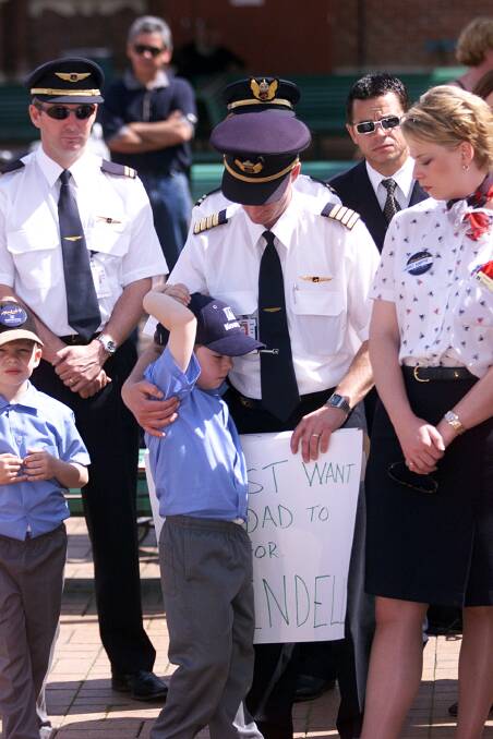 FLASHBACK: Kendell Airlines staff rally in Albury after the 2001 Ansett Australia collapse. Barry Anderson stands with his then eight-year old son Bryce, who is now a captain himself.