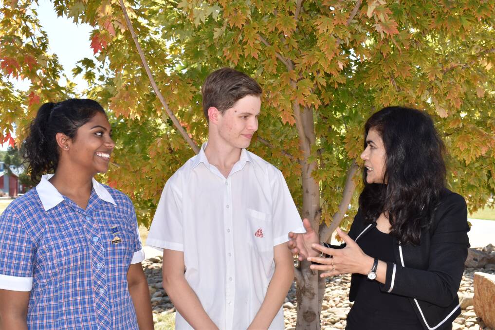 INDUSTRY INSPIRATION: Trinity Anglican College year 12 student Madhulikaa Sarjapuram and Finlay Campbell, of year 11, talk with Professor Veena Sahajwalla during her visit to the school on Wednesday. 