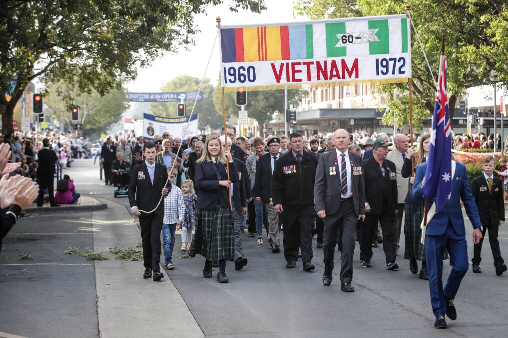 SPECIAL EVENT: Crowds cheer as veterans march down Albury's Dean Street during the 2019 Anzac Day parade. Picture: JAMES WILTSHIRE