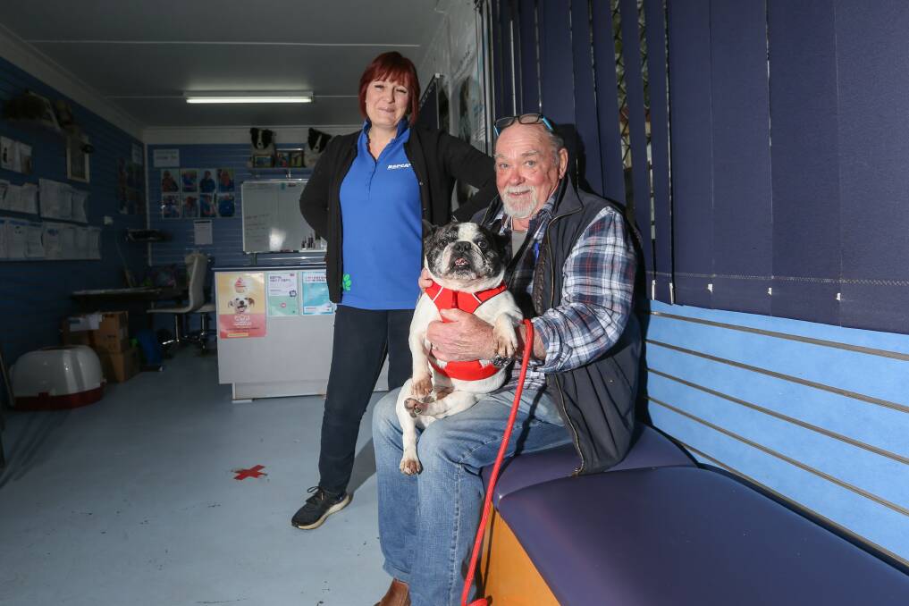 DOGGONE IT: Cause program co-ordinator Cathy Woodbridge, volunteer Colin Barrow and Larry the French bulldog look forward to Saturday's garage sale and open day. Picture: TARA TREWHELLA