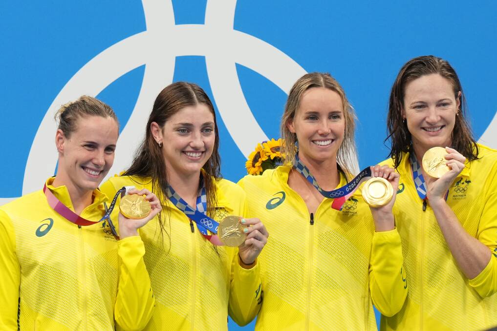 CHAMPIONS: Bronte Campbell, Meg Harris, Emma McKeon and Cate Campbell hold their gold medals after winning the women's 4 x 100m freestyle relay final in a world record time at the Tokyo Aquatic Centre. Picture: JOE GIDDENS/AAP