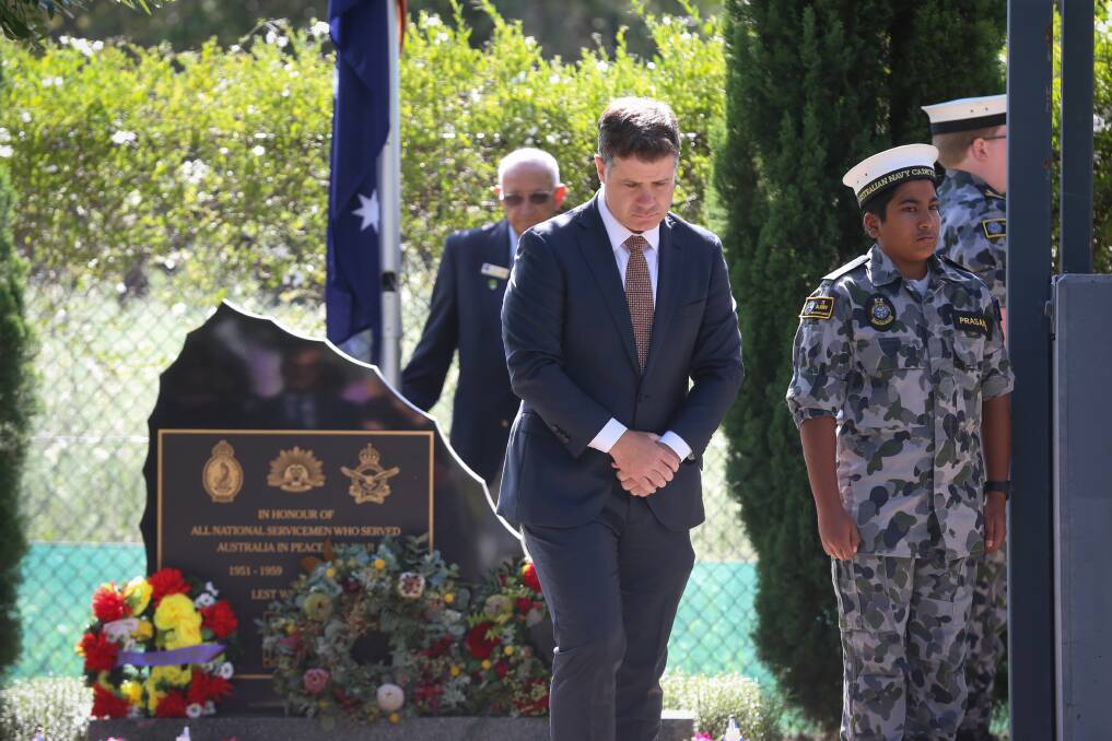SILENT TRIBUTE: Member for Albury Justin Clancy honours national servicemen. Picture: JAMES WILTSHIRE