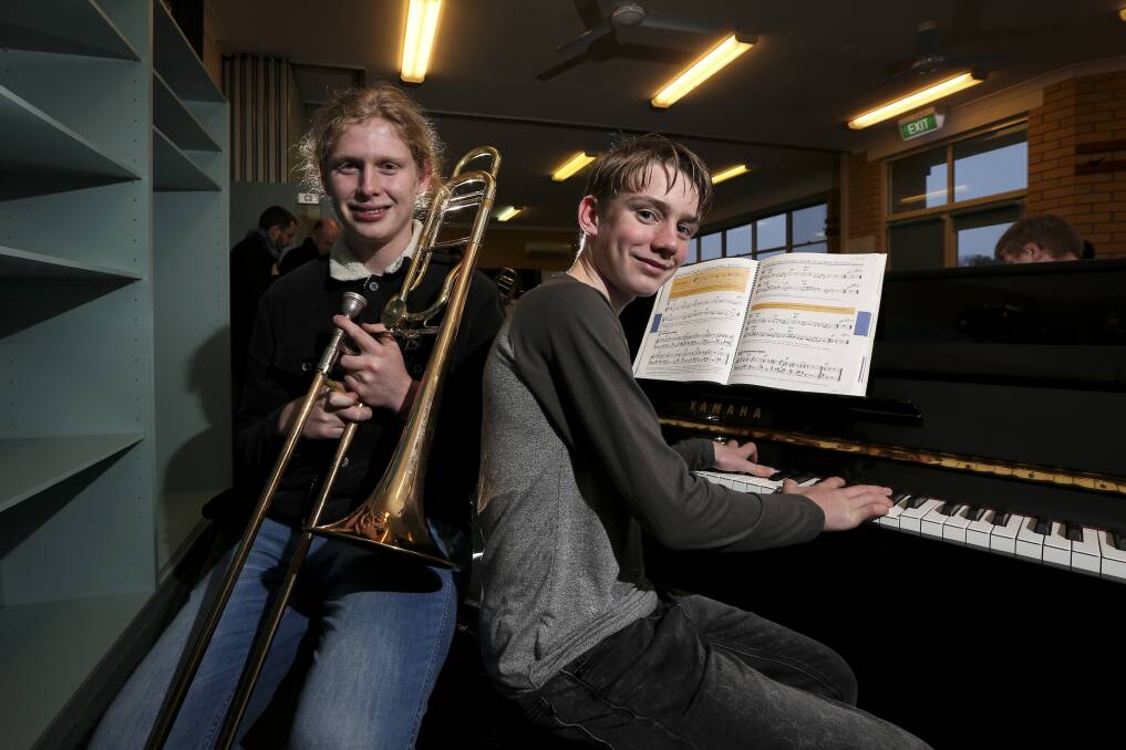 HAPPY CAMPERS: Oscar Dean, 17, and Tom Summerfield, 14, enjoy last year's Border Music Camp at The Scots School Albury.