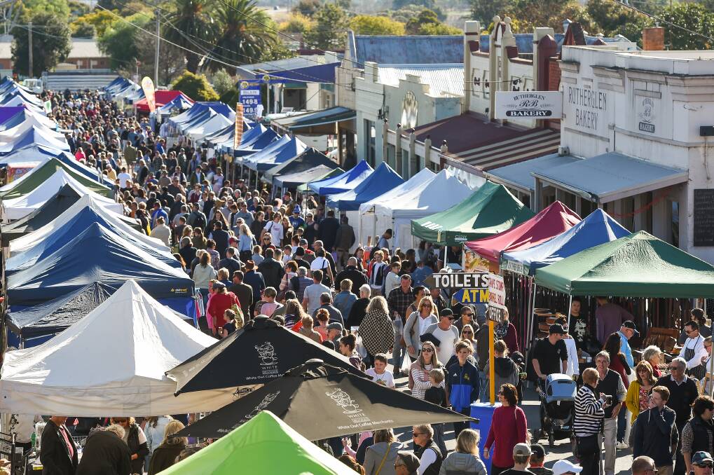 BRINGING PEOPLE IN: Crowds flock to the street market at Rutherglen's Winery Walkabout on Sunday. Picture: MARK JESSER