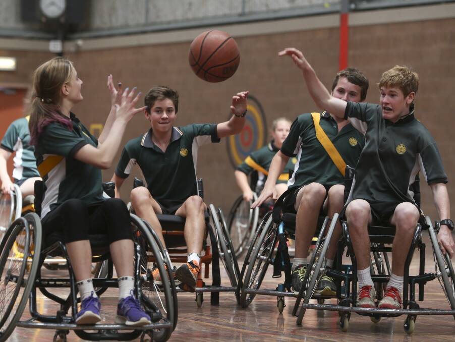 FIERCE CONTEST: Students at Rutherglen High School have a go at playing sport in a wheelchair during a day of activities that aim to promote inclusion.