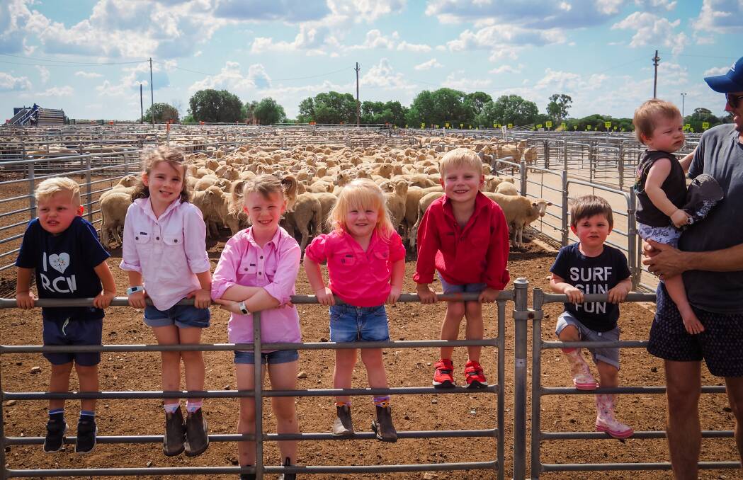 GROWING KIDS: Flynn Ollington, Natalie Clifton, Sophie Clifton, Amelia Clifton, Benjamin Playford, Judd Talbot and Ollie Talbot, with his father Steve, all have reasons to be thankful for the Royal Children's Hospital. The group was photographed at Corowa saleyards in February. Picture: AMBER CLIFTON