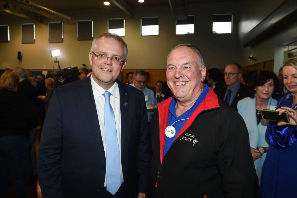 FAMILY WELFARE: Prime Minister Scott Morrison talks to Albury's Colin Darts in 2018. Mr Darts OAM works to support the spouses and children of deceased service personnel.