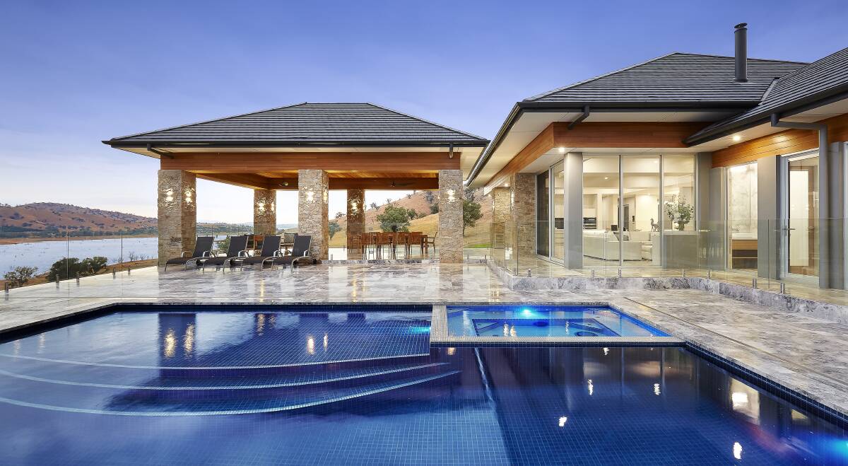 ENTERTAINER'S DELIGHT: The alfresco lies in the centre of the home next to the infinity edge swimming pool. The Wirlinga property includes a 24-square shed, with four garage doors and a bathroom, and a private floating jetty.
