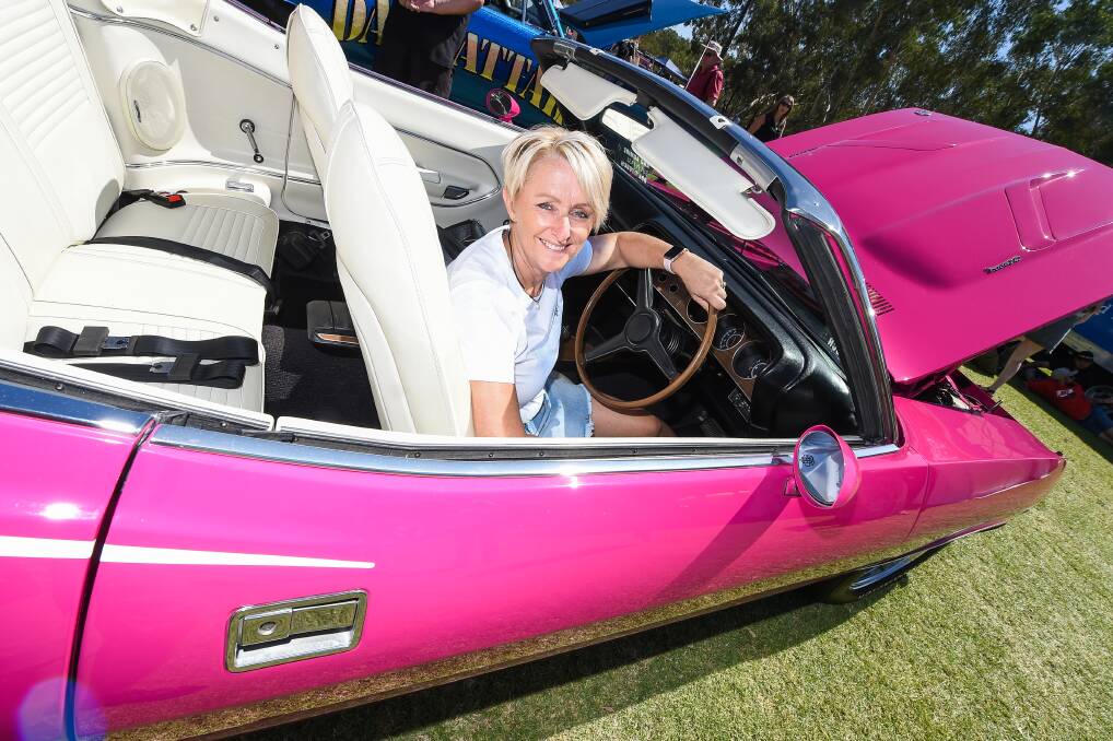 HOT PINK: Leanne Collicoat, in her 1970 Plymouth barracuda convertible, has attended Chryslers on the Murray for 27 years. Picture: MARK JESSER