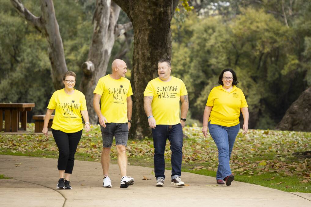 BACK TO NOREUIL PARK: After two years of virtual events, a group Sunshine Walk will be held on Sunday, November 6. Benalla couple Sunnie and Richard Bull, along with Albury's Mark Haley are this year's ambassadors, walking here with Albury Wodonga Regional Cancer Centre Trust Fund board member Di Thomas. Picture: ASH SMITH