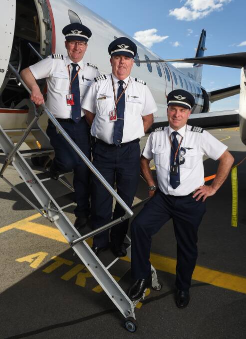 TWENTY-YEAR TRIO: Barry, Tony and Peter have appreciated being able to fly aeroplanes and still live regionally. Picture: MARK JESSER