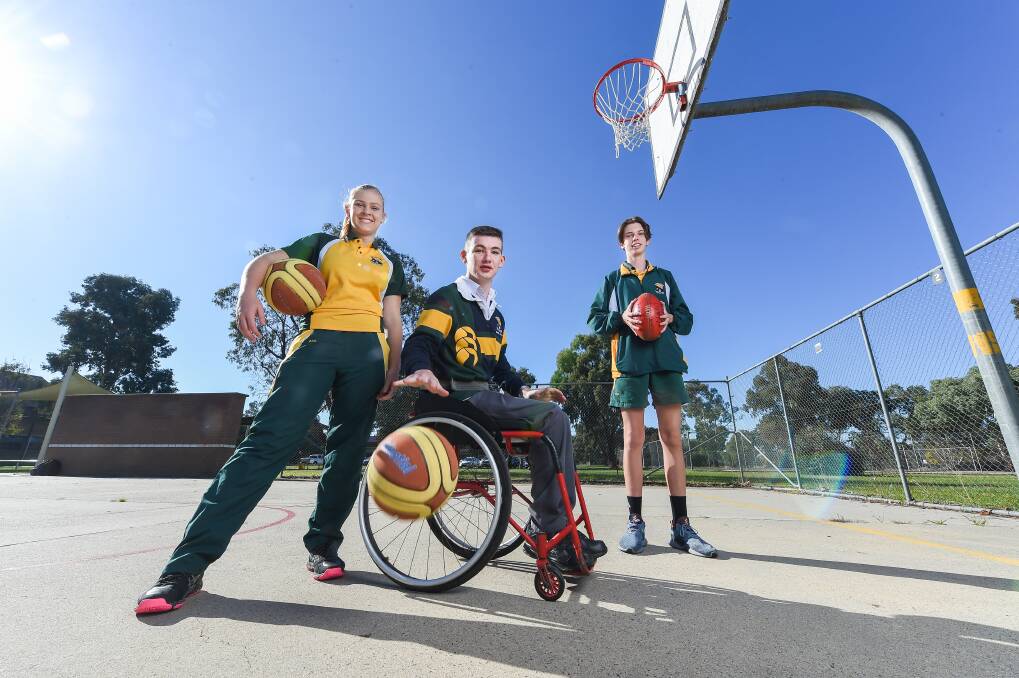 KEEPING ACTIVE: Billabong High School students Maggie Jamieson, 14, Hayden Honeywill, 17, and Ben Medley, 15, enjoy some fresh air and exercise ahead of the SportsAbility Fun Day in Culcairn on June 3. Picture: MARK JESSER