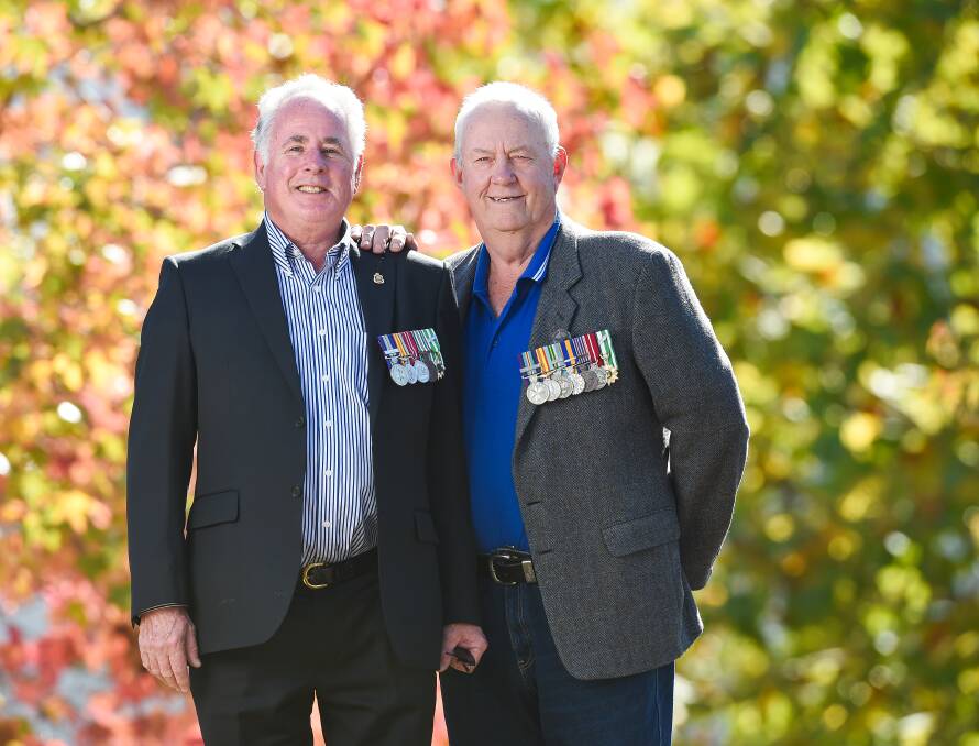 COLLECTIVE AWARD: Bryan Meehan, 72, of Myrtleford, and Sandy Creek's Doug Dupille, 71, look forward to seeing their battalion honoured. Picture: MARK JESSER