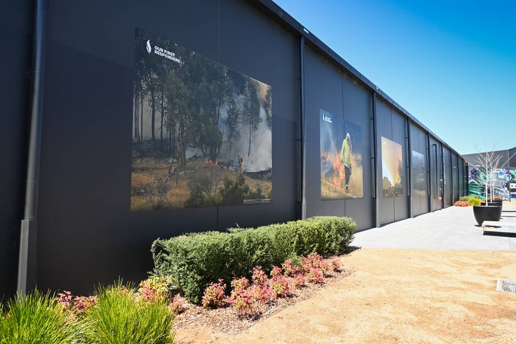 FIRE IMAGES: The large panels of Our First Responders will be installed indefinitely on the Mann bulding, High Street, Wodonga. Picture: MARK JESSER