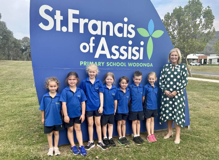 St Francis of Assisi Primary School Wodonga year 1 students Nova Buckley, Evie Diretto, Georgie Day, Evelyn Smith, Thomas Laracy, Jed Basham and Emma Goonan stand with principal Jennyne Wilkinson on the last day of term one. Picture supplied