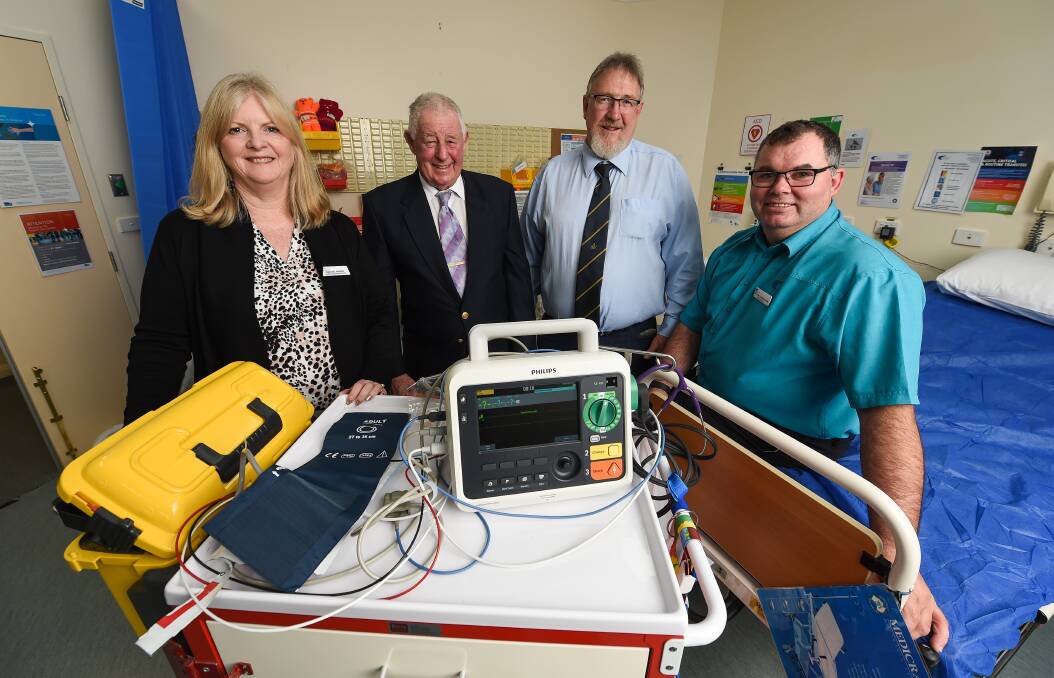 GIFT OF LIFE: Tallangatta Health chief executive Denise Parry and nurse manager Haydon Cunninghame (right) with Benambra Lodge Master Ernie Cole and Immediate Past Master Ross Smith. Picture: MARK JESSER