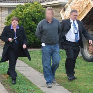 Police take Adam Gilbert Jolly from the Wingara Street home after the early morning raid. Picture: NSW POLICE MEDIA