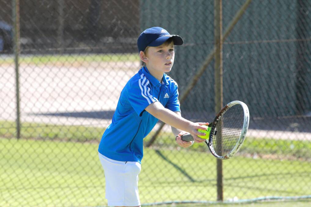 Daly Kerr, of Albany, is a picture of concentration as he prepares to serve.