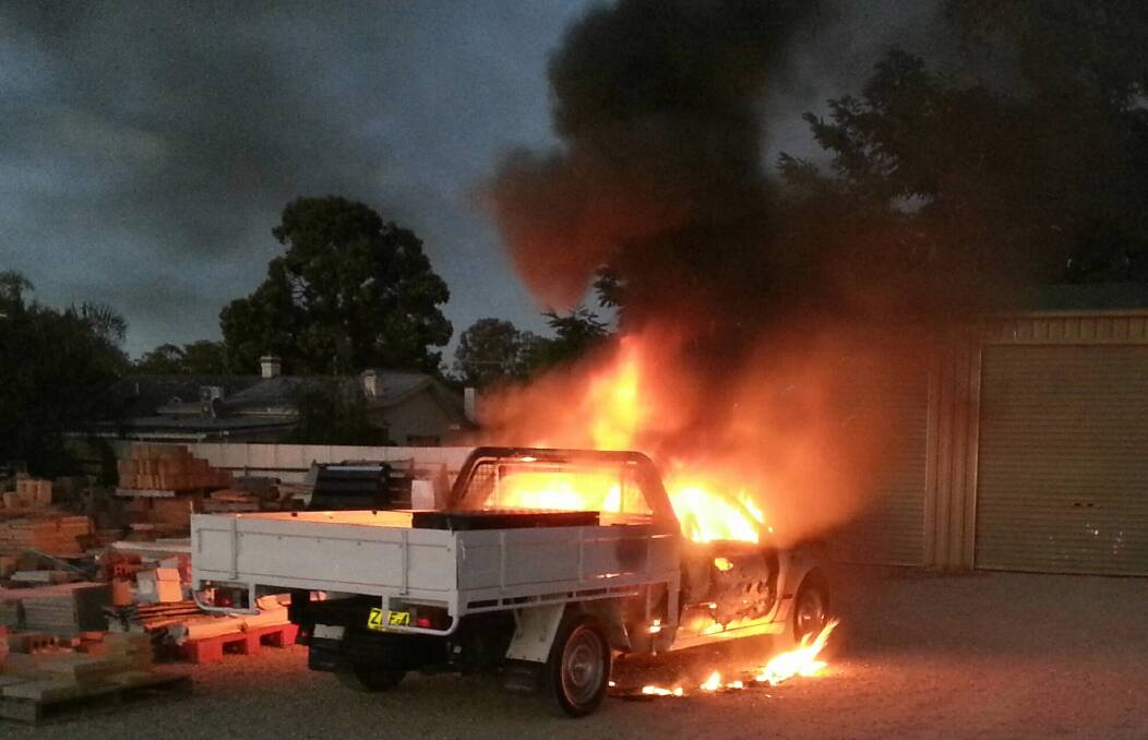 A ute was found well alight at the back of a South Albury plumbing business yesterday. Picture: SUPPLIED
