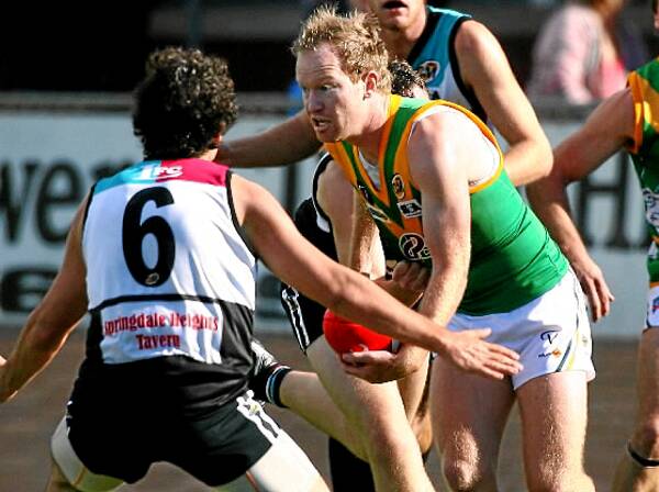 Young Hopper Robbie Norris emerges with the ball at Lavington on Saturday.