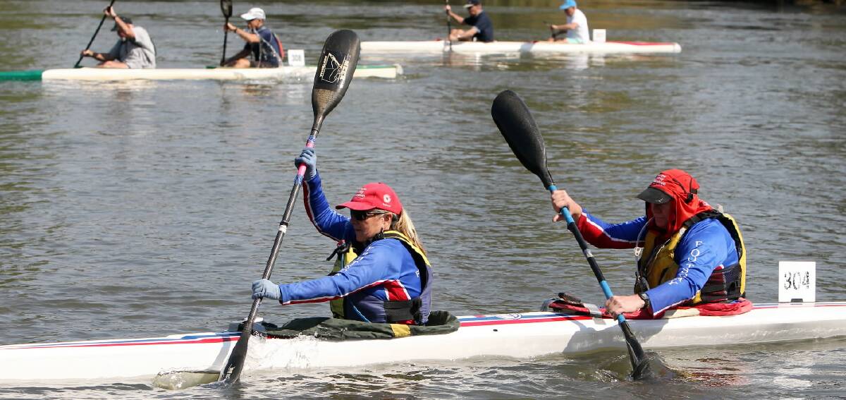 Competition was fierce yesterday as the K2 paddlers pass the Albury Waterworks yesterday in the Frank Harrison memorial. Pictures: KYLIE ESLER